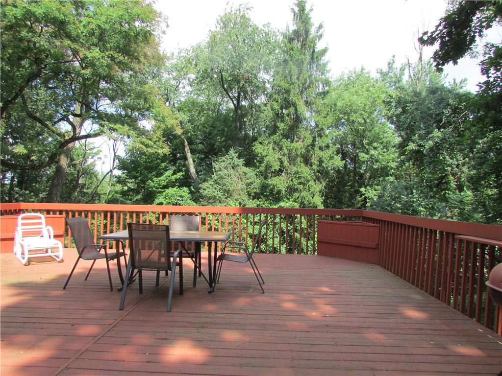 138 Crescent Hills Road Pittsburgh, PA 15235 - Photo 14 of 25 Relax under the trees, or entertain on the expansive rear deck.