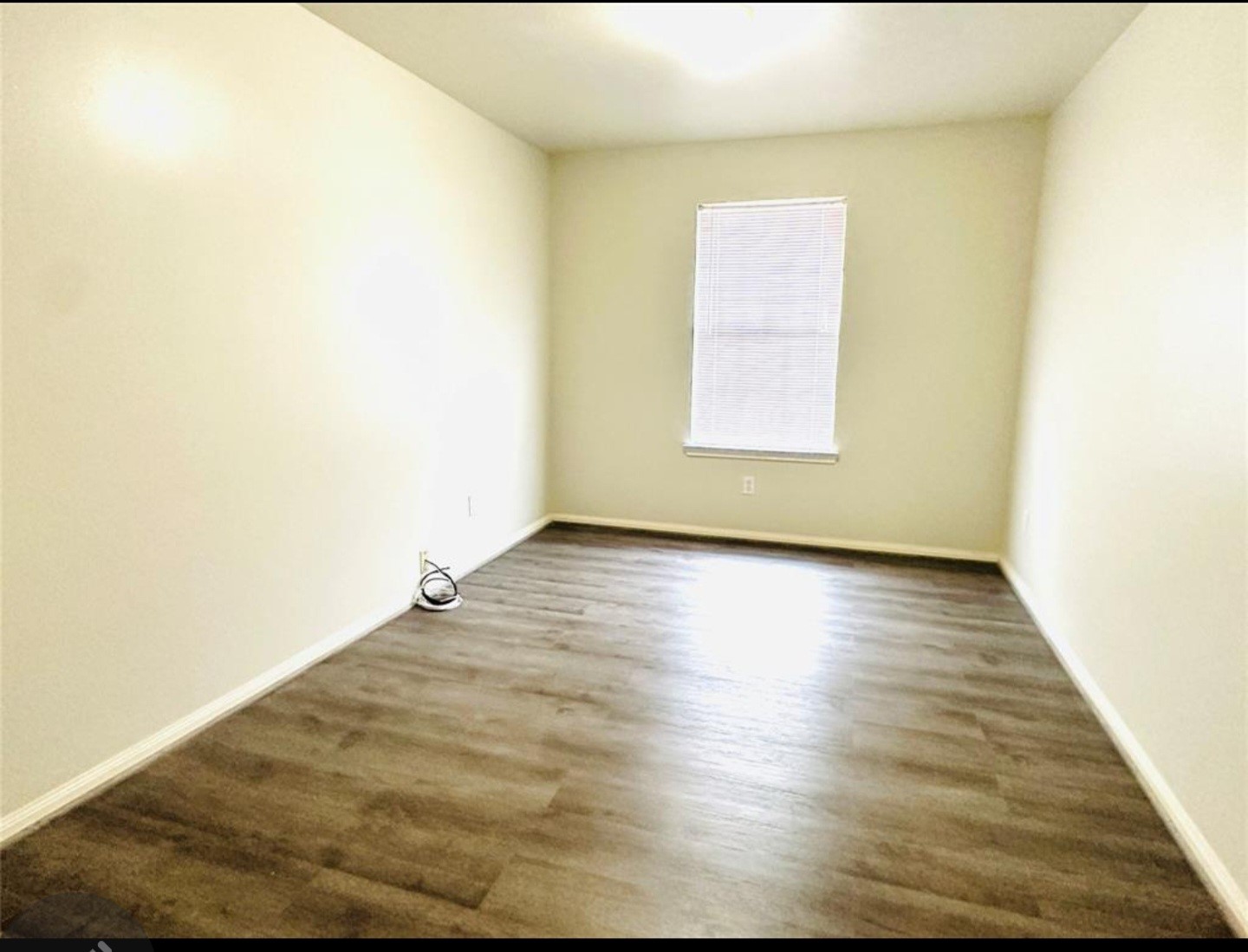 7203 Calcutta Spring Drive Houston, TX 77083 - Photo 13 of 14 a view of room with window and wooden floor