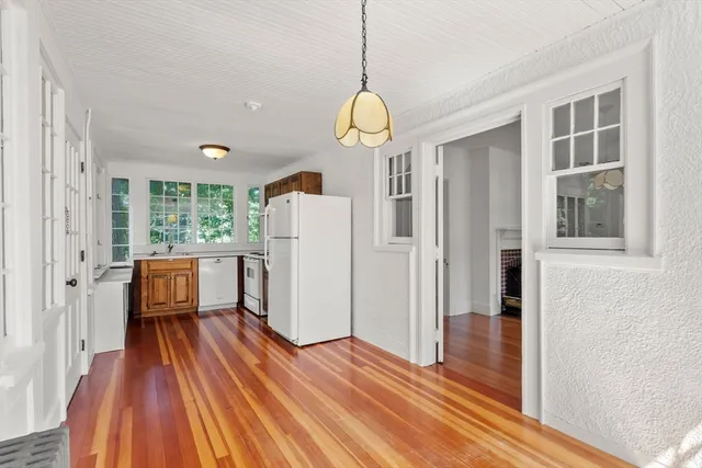 a view of a livingroom with wooden floor