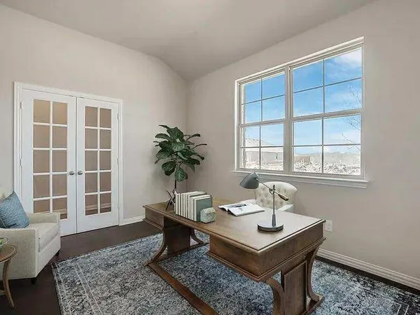 a living room with a couch and a window