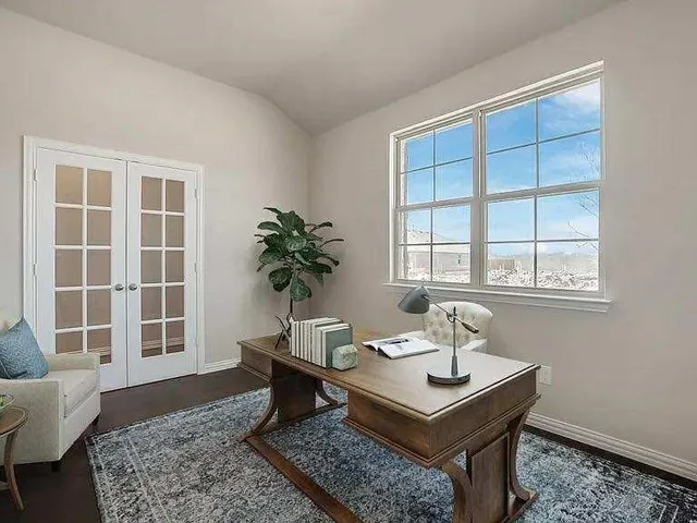 a living room with a couch and a window