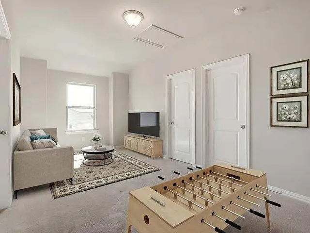 a bedroom with a bed and a couch