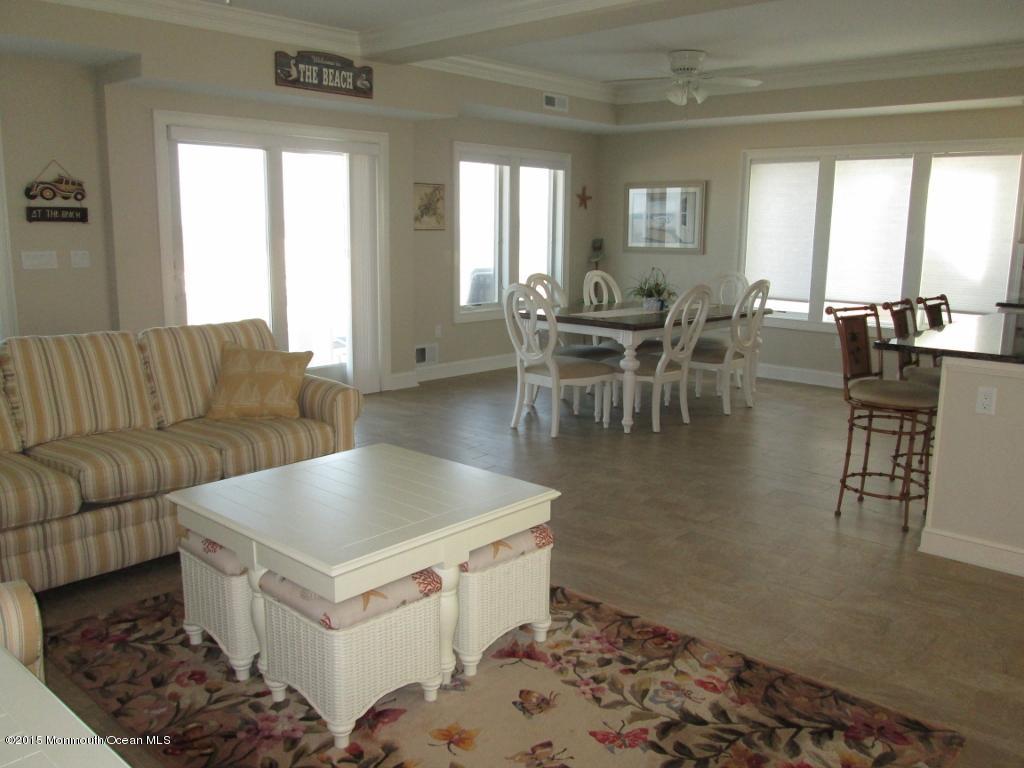 3450 Ocean Road Lavallette, NJ 08735 - Photo 7 of 31 a living room with furniture and a large window
