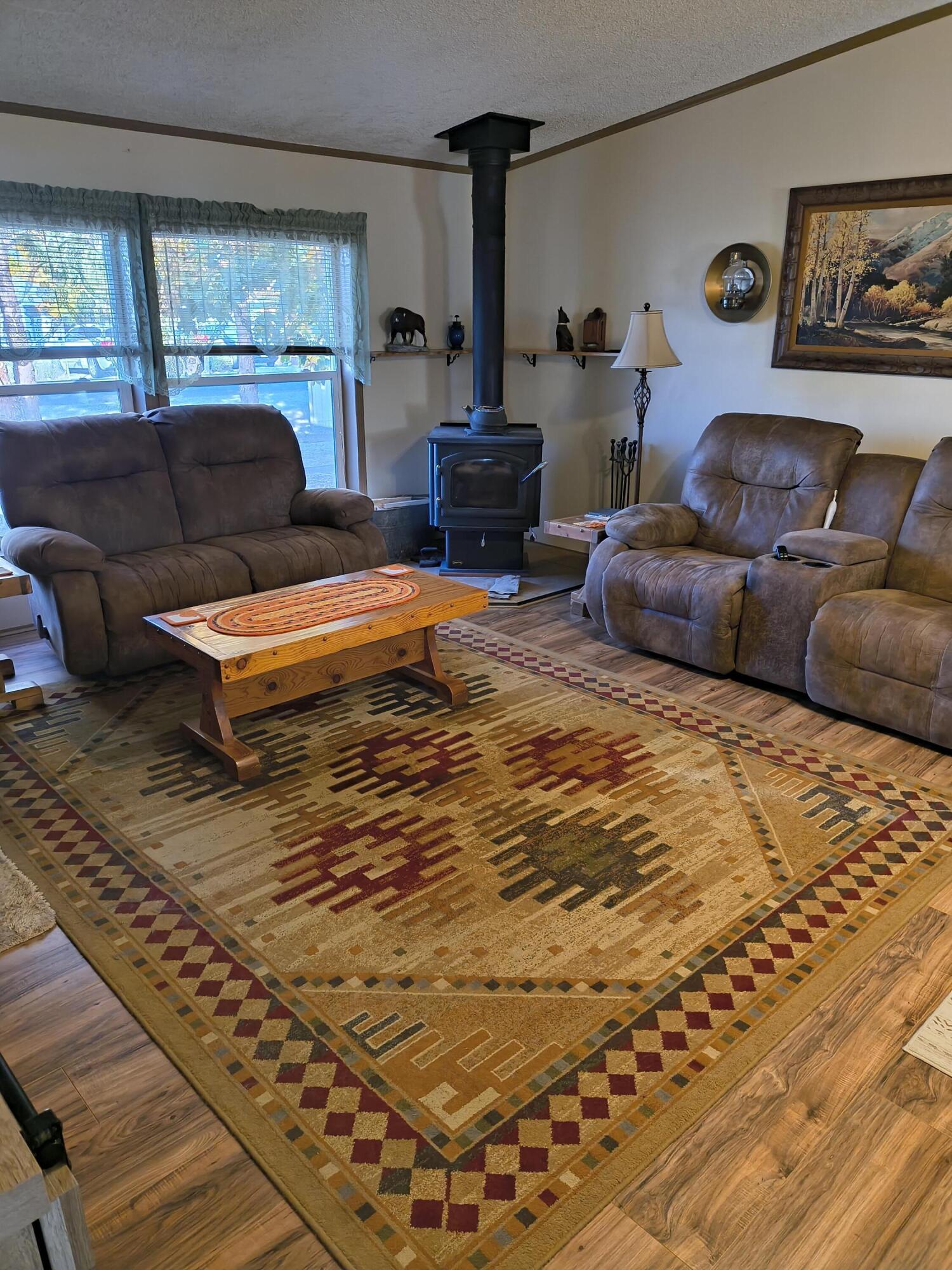 235 North Roosevelt Street Merrill, OR 97633 - Photo 3 of 27 a bedroom with a bed and a couch
