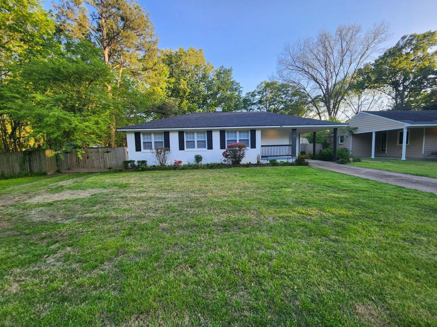 5259 Sequoia Road Memphis, TN 38120 - Photo 2 of 36 front view of a house with a yard