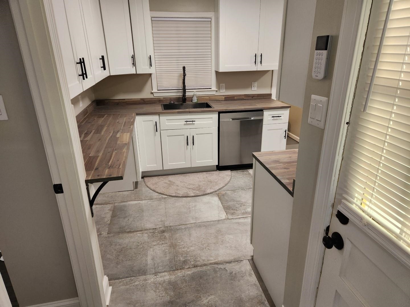 5259 Sequoia Road Memphis, TN 38120 - Photo 7 of 36 a kitchen with a sink and cabinets