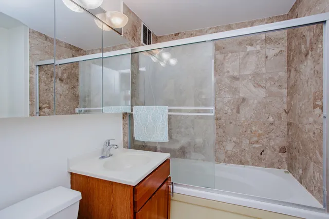 a lobby with furniture and a flat screen tv