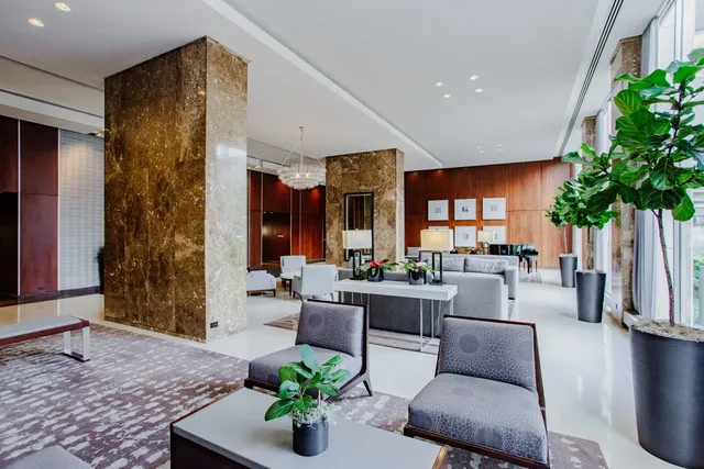 a living room with furniture and flat screen tv