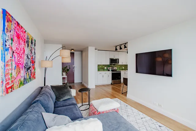 a living room with furniture and a window