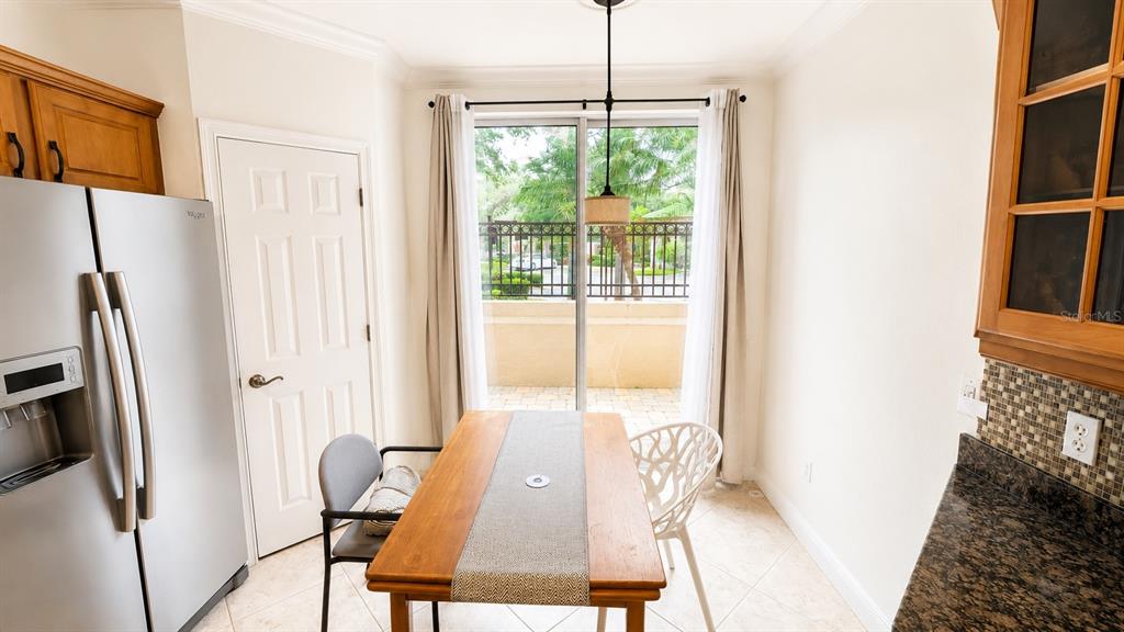 6552 Moorings Point Circle, Unit 102 Lakewood Ranch, FL 34202 - Photo 11 of 57 a view of a dining room with furniture window and refrigerator