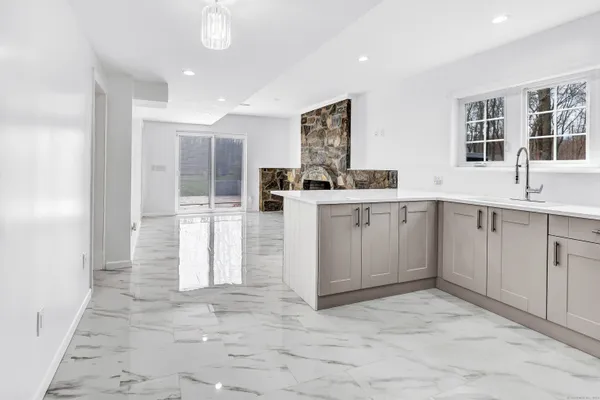 a kitchen with a sink and cabinets