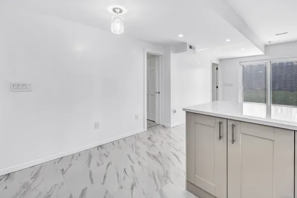 a kitchen with stainless steel appliances a refrigerator and a stove top oven