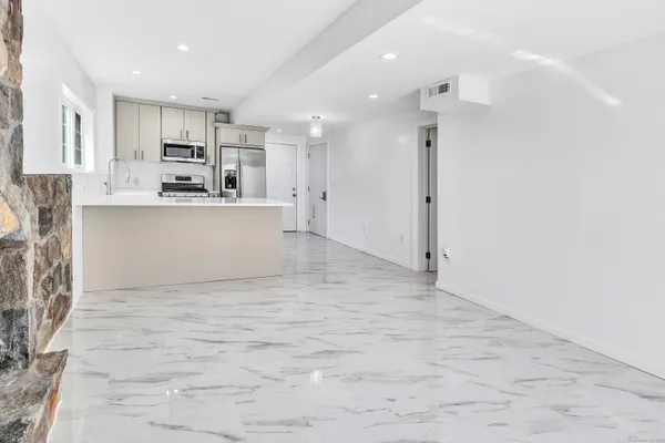 a view of a kitchen with a sink