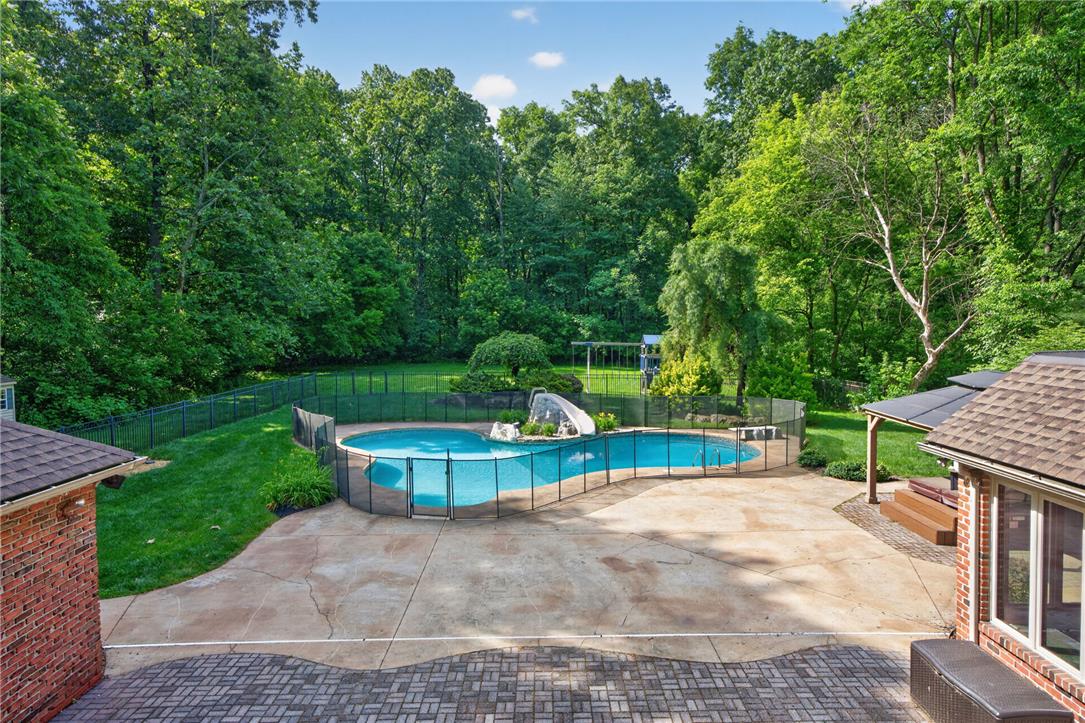 1371 Stoke Park Road Bethlehem, PA 18017 - Photo 8 of 55 a view of a house with pool and a yard