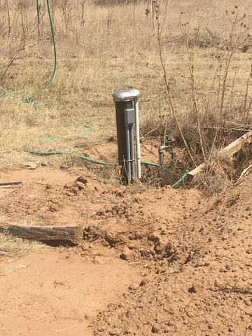 a view of a wooden floor and a building in the background