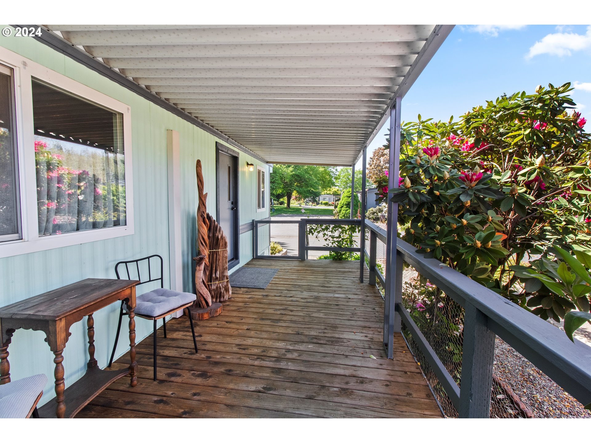 1400 Candlelight Drive, Unit 185 Eugene, OR 97402 - Photo 16 of 46 a view of outdoor space with wooden floor and seating space