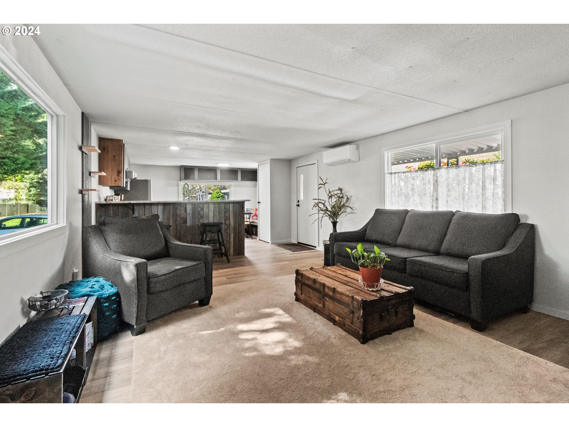 1400 Candlelight Drive, Unit 185 Eugene, OR 97402 - Photo 17 of 46 a living room with furniture and a large window