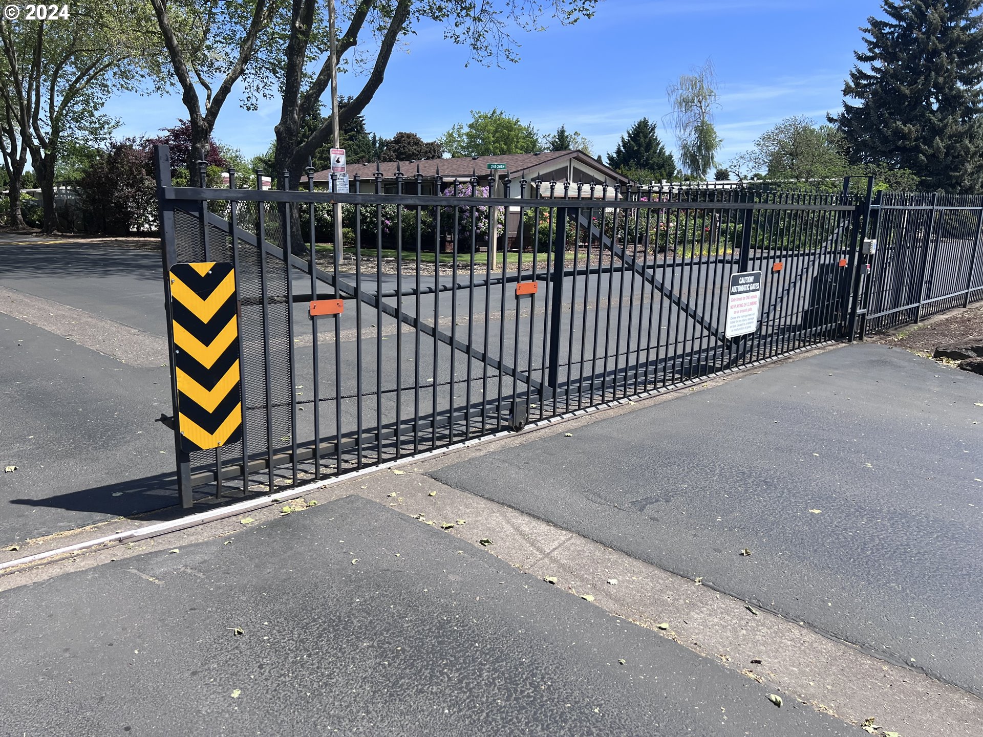 1400 Candlelight Drive, Unit 185 Eugene, OR 97402 - Photo 45 of 46 a view of a street with wooden fence