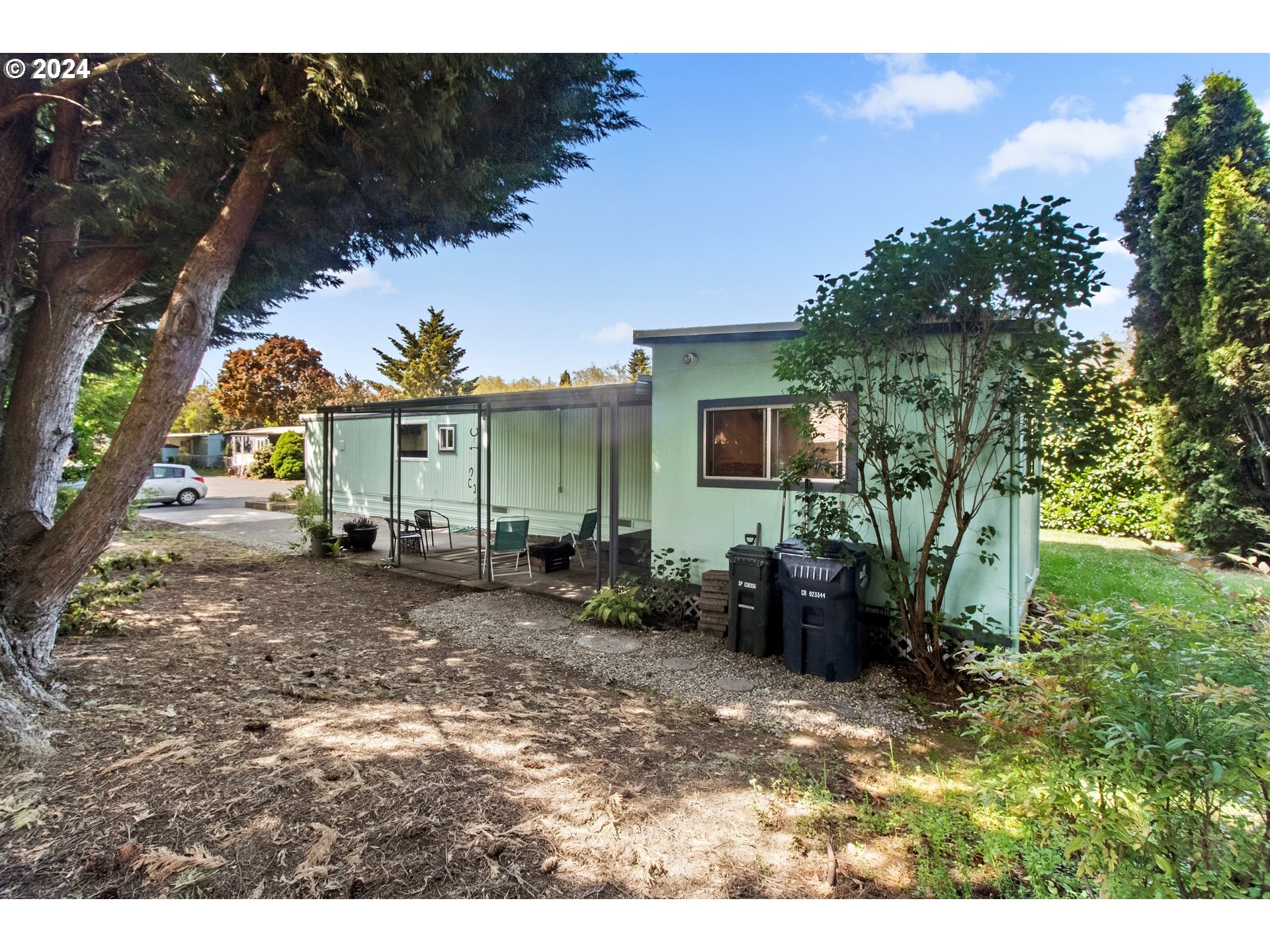 1400 Candlelight Drive, Unit 185 Eugene, OR 97402 - Photo 10 of 46 a view of a house with backyard and sitting area