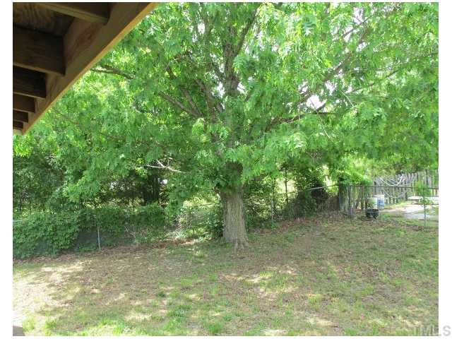 1923 Shaw Road Durham, NC 27704 - Photo 14 of 17 a view of a yard with a tree