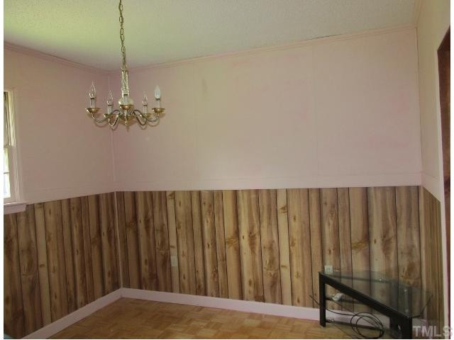 1923 Shaw Road Durham, NC 27704 - Photo 4 of 17 a view of a room with a wooden door