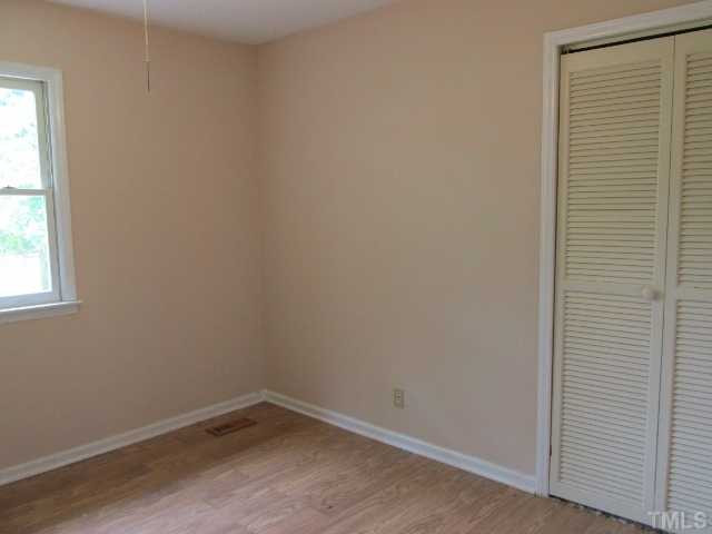 1923 Shaw Road Durham, NC 27704 - Photo 8 of 17 a room that has a window in it