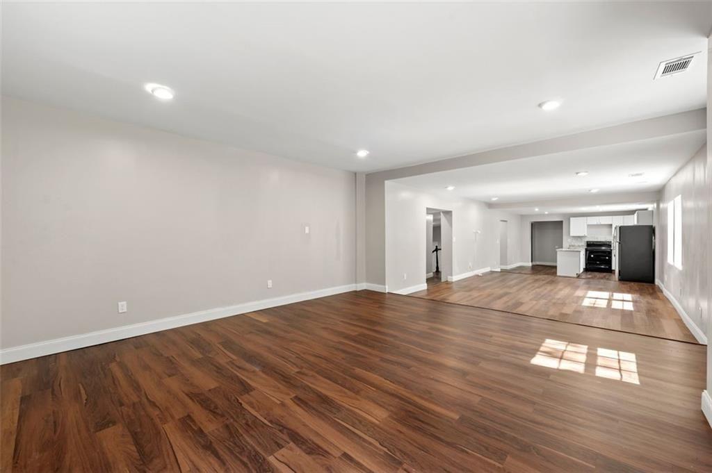 3480 Hogan Road Southwest Atlanta, GA 30331 - Photo 12 of 25 wooden floor in an empty room