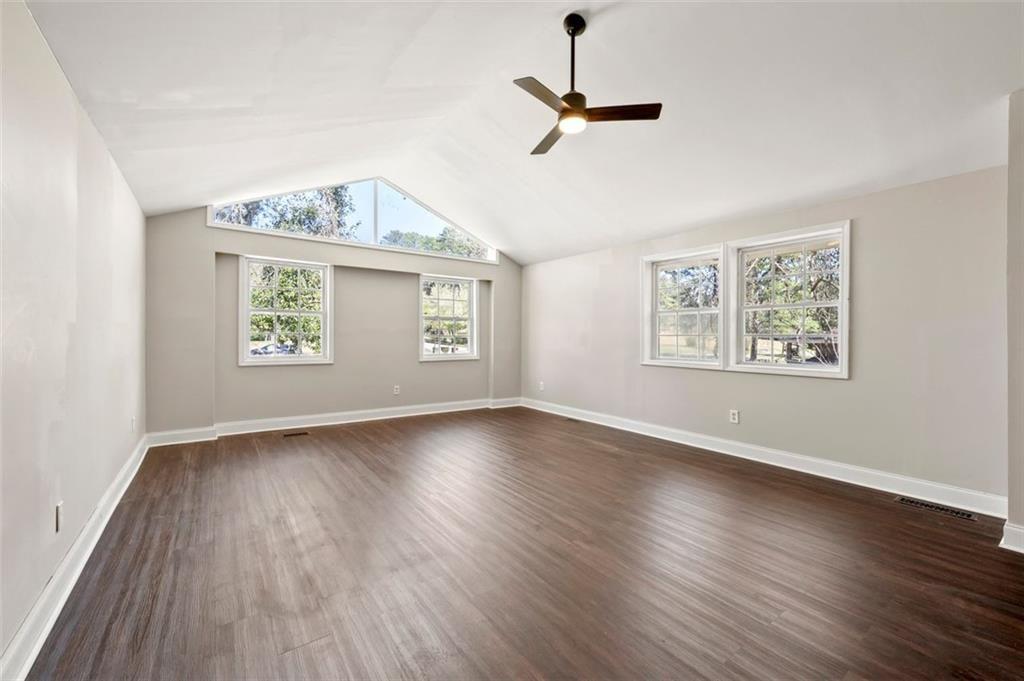 3480 Hogan Road Southwest Atlanta, GA 30331 - Photo 14 of 25 a view of an empty room with a window and wooden floor