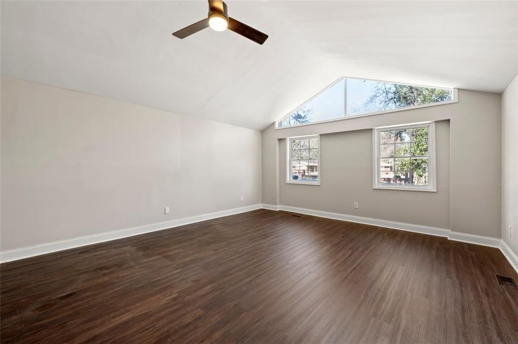 3480 Hogan Road Southwest Atlanta, GA 30331 - Photo 21 of 25 an empty room with a window and wooden floor