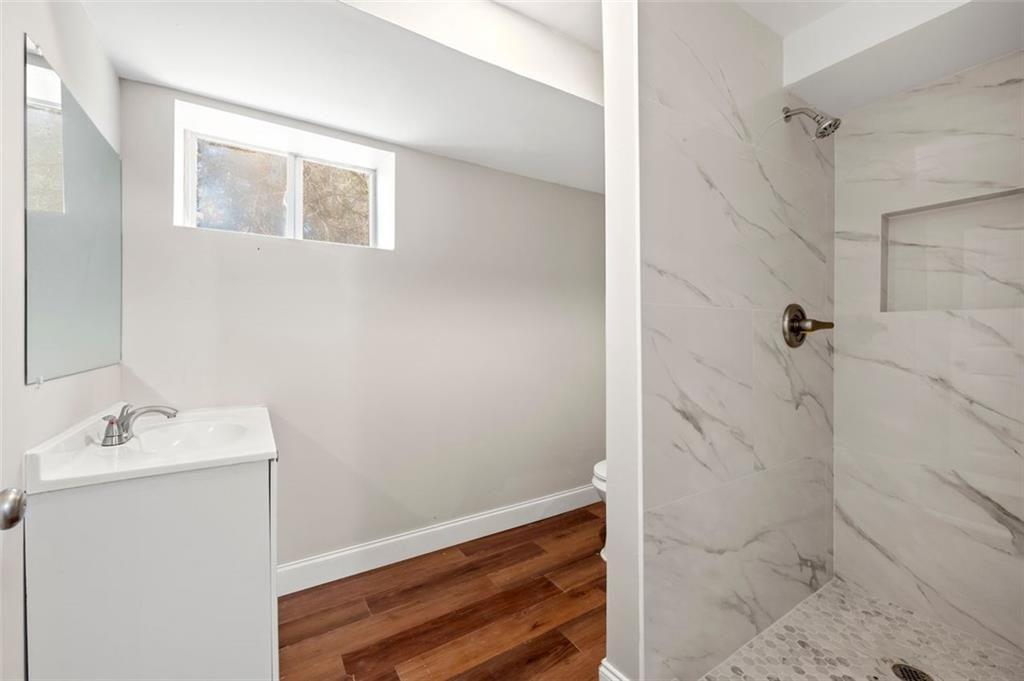 3480 Hogan Road Southwest Atlanta, GA 30331 - Photo 23 of 25 a bathroom with a sink and a mirror