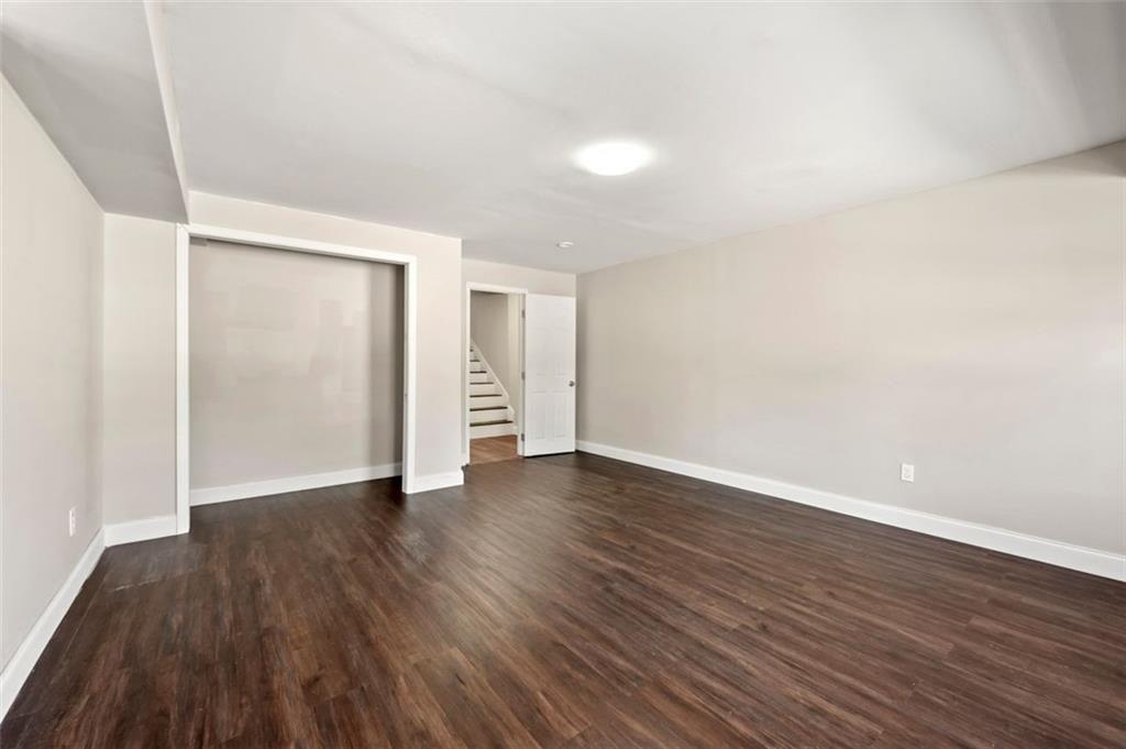 3480 Hogan Road Southwest Atlanta, GA 30331 - Photo 24 of 25 a view of an empty room with wooden floor