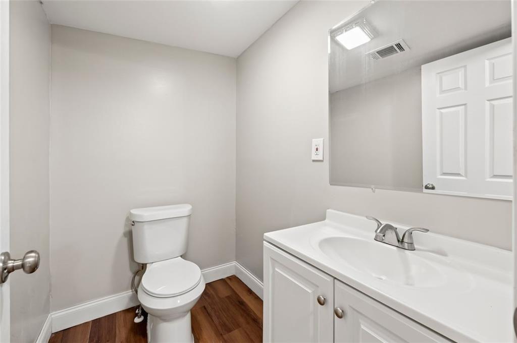 3480 Hogan Road Southwest Atlanta, GA 30331 - Photo 4 of 25 a white toilet sitting next to a bathroom sink