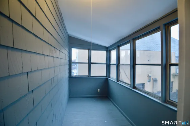 a view of room with window and cabinet