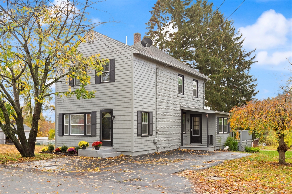 93 Bay State Road Methuen, MA 01844 - Photo 2 of 23 a front view of a house with a tree