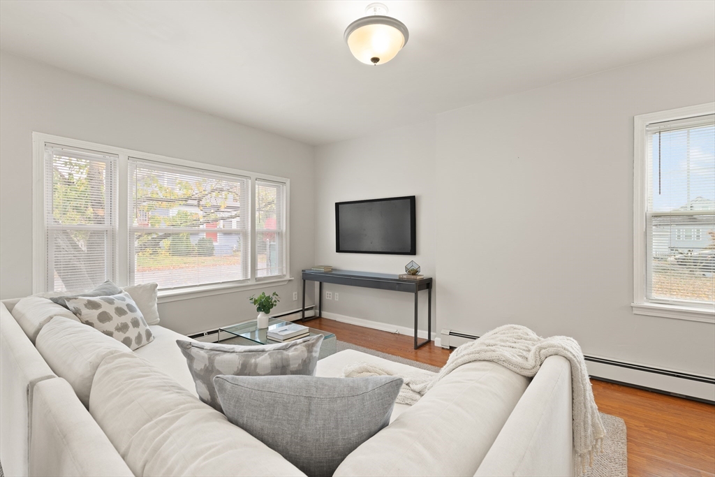 93 Bay State Road Methuen, MA 01844 - Photo 4 of 23 a living room with furniture and a flat screen tv