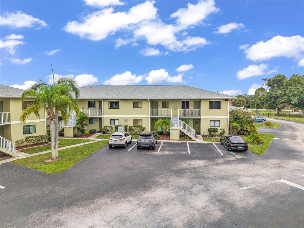 25225 Rampart Boulevard, Unit 1604 Punta Gorda, FL 33983 - Photo 32 of 41 a view of a house with a backyard and a patio