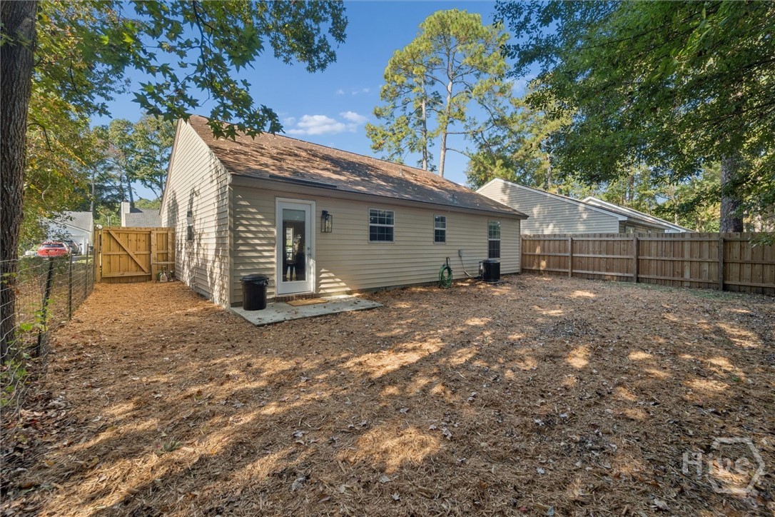 7206 Garfield Street Savannah, GA 31406 - Photo 13 of 29 Spacious fenced yard off door through kitchen