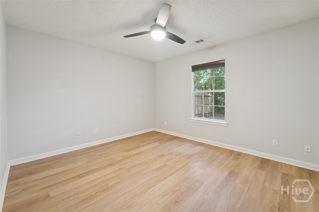 7206 Garfield Street Savannah, GA 31406 - Photo 16 of 30 Primary suite with view to tranquil and private backyard