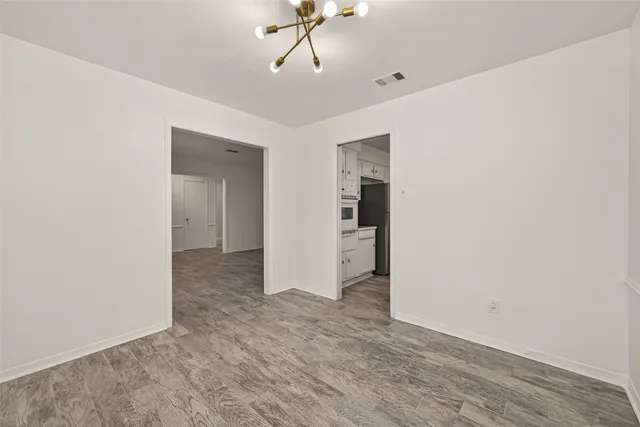 a view of a room with a sink and cabinet