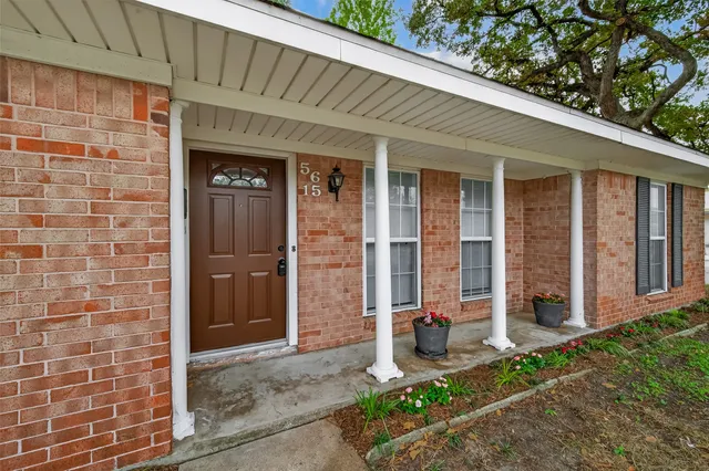 a front view of a house with a glass door
