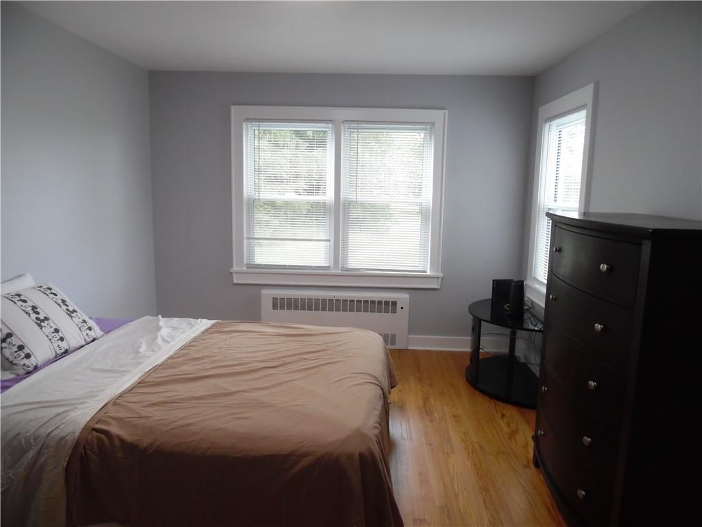 105 Dr Duggan Road Bethel, NY 12720 - Photo 23 of 29 Bedroom featuring light hardwood / wood-style flooring and radiator