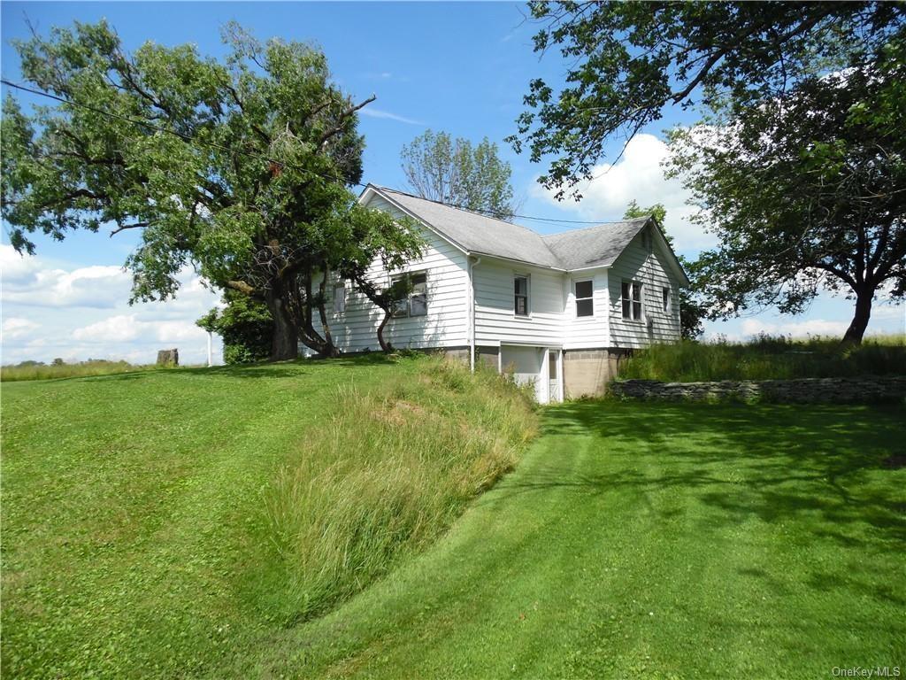 105 Dr Duggan Road Bethel, NY 12720 - Photo 7 of 29 View of property exterior featuring a yard