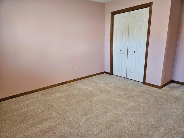a view of an empty room and entryway