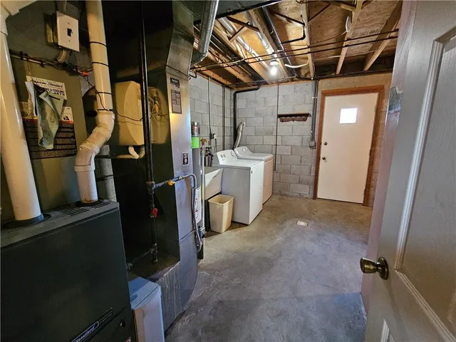 a view of a storage & utility room with closet dryer