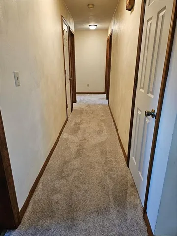 a view of hallway with stairs