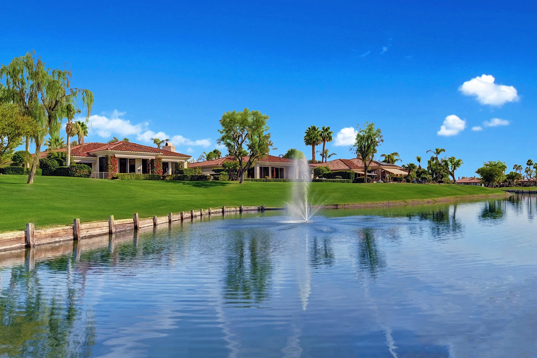 79593 Pomo La Quinta, CA 92253 - Photo 7 of 39 BACK OF HOME OVER LAKE ANGLED
