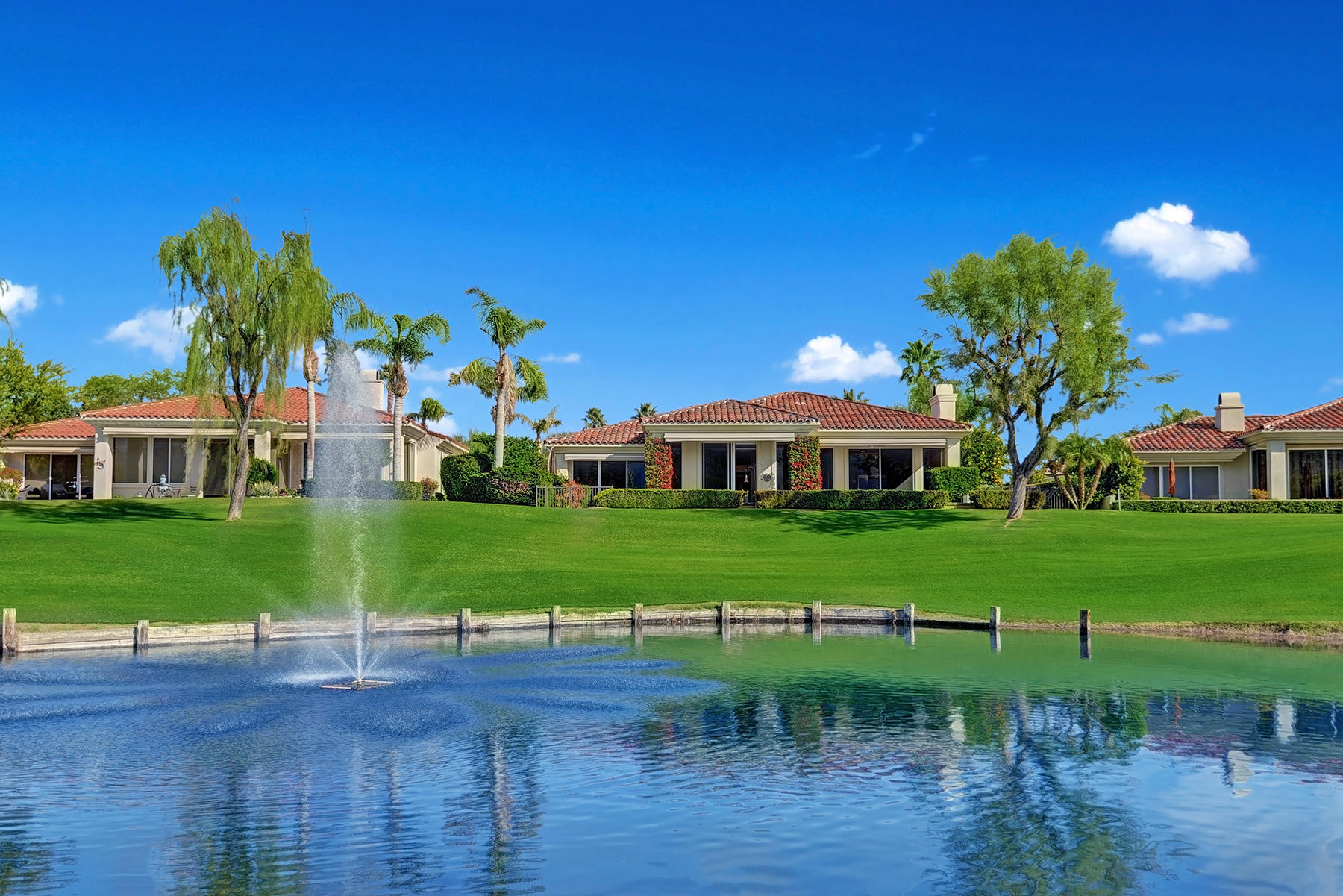 79593 Pomo La Quinta, CA 92253 - Photo 9 of 39 OVER LAKE TO BACK OF HOME