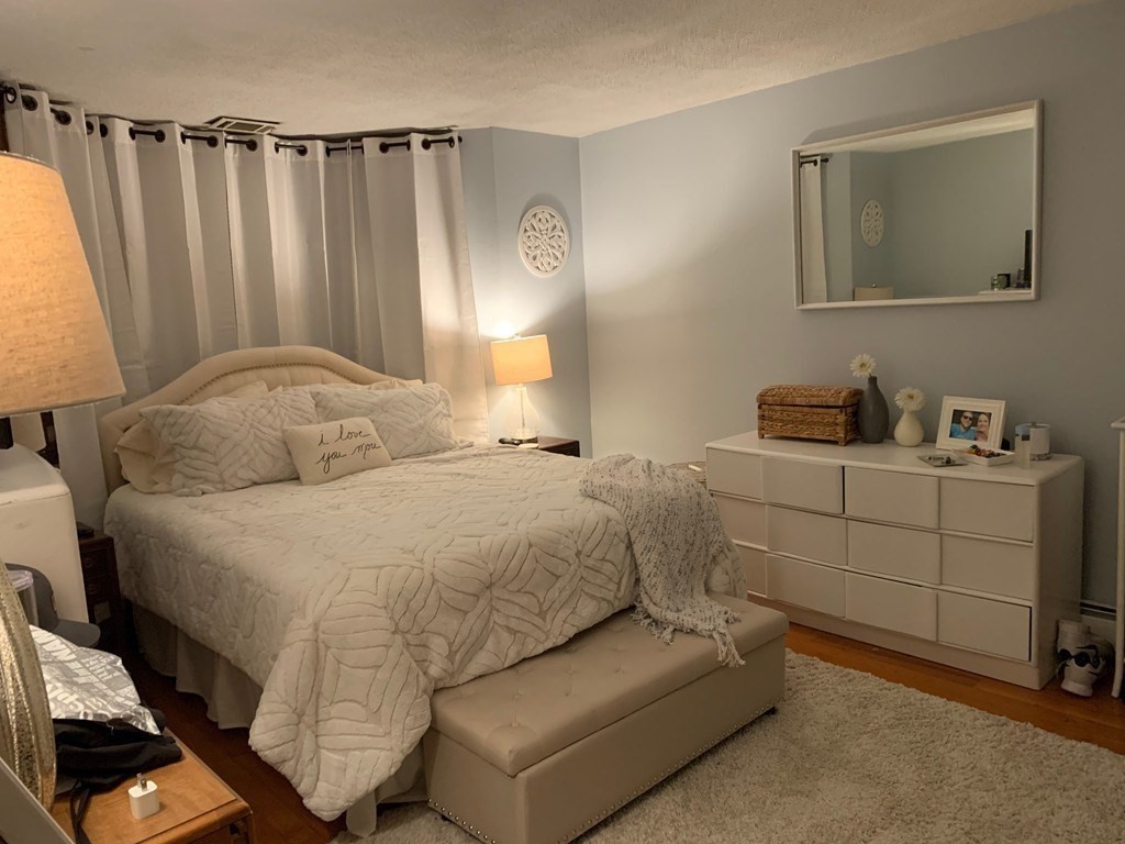a bedroom with a bed and a cabinets