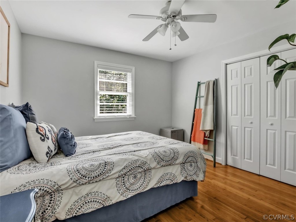 8166 Brown Road Richmond, VA 23235 - Photo 21 of 27 a bedroom with a bed and a chandelier