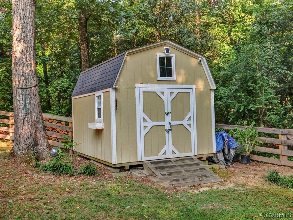 8166 Brown Road Richmond, VA 23235 - Photo 27 of 27 a front view of a house with garden
